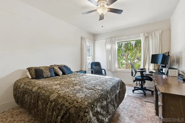 a bed room with a bed and a chandelier