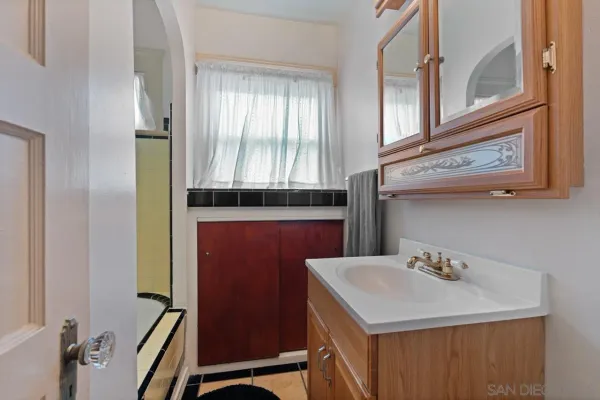 a bathroom with a sink and a mirror