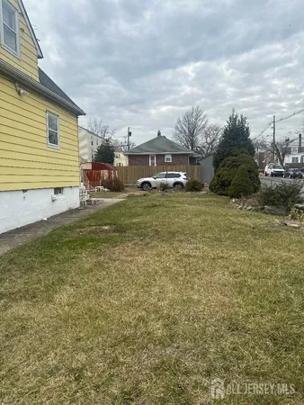a view of a patio with a yard