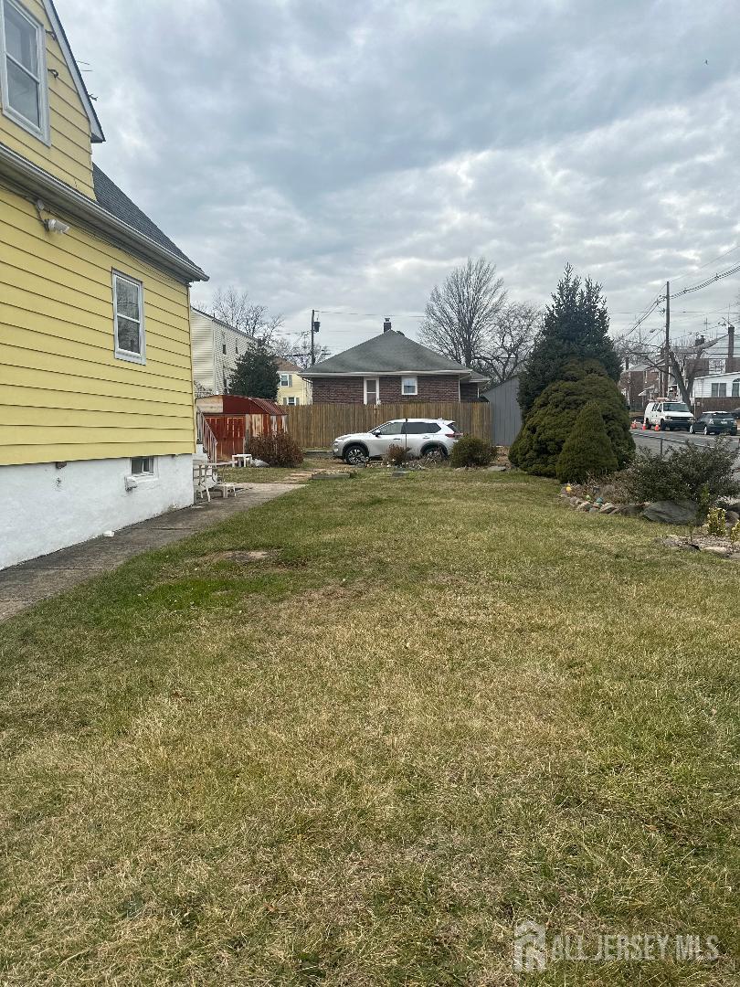 653 Raritan Avenue Perth Amboy, NJ 08861 - Photo 2 of 3 a view of a patio with a yard