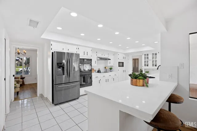 a kitchen with stainless steel appliances a refrigerator and a sink