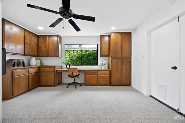 a kitchen with sink cabinets and window
