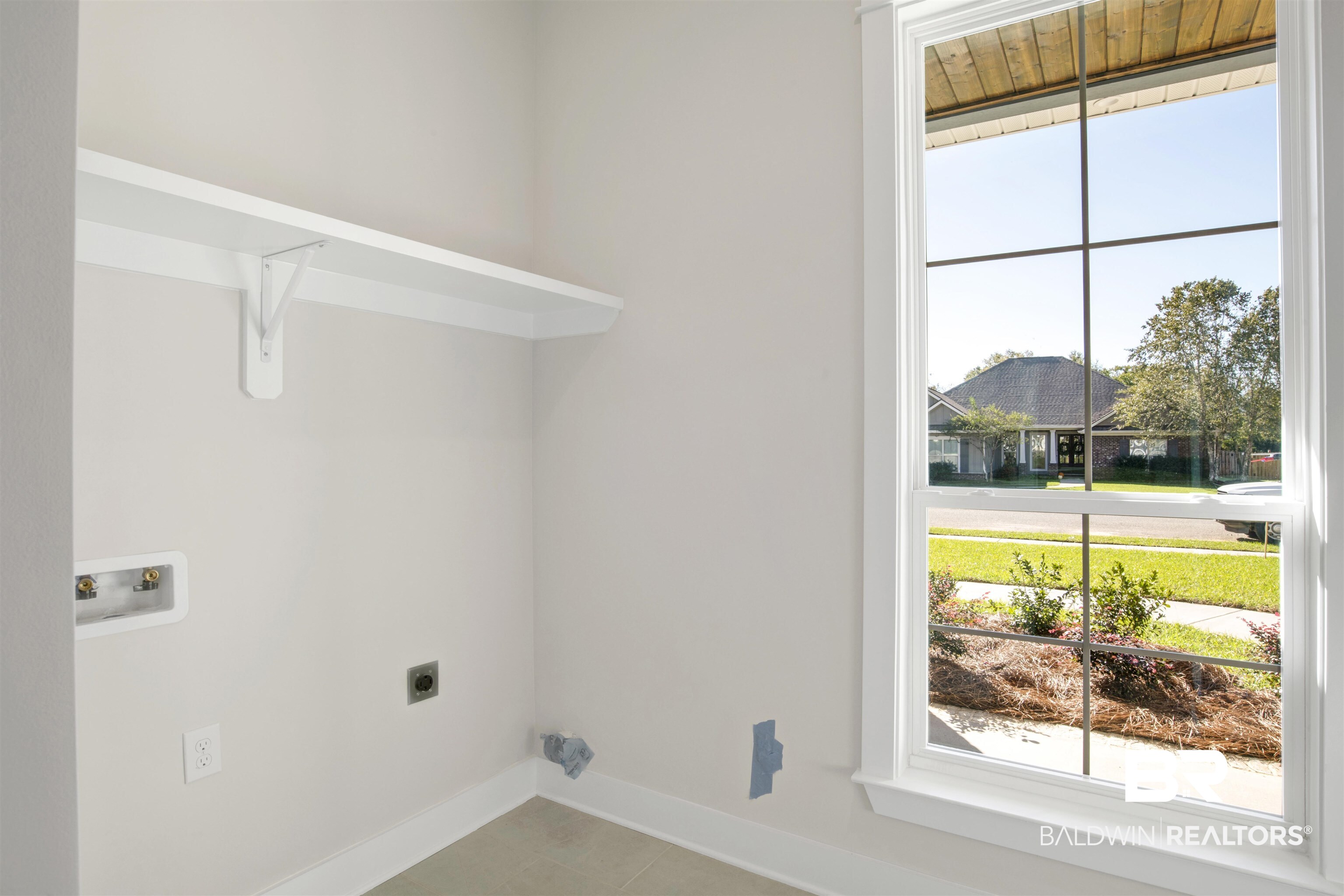 9687 Widgeon Court Daphne, AL 36526 - Photo 27 of 40 Washroom with electric dryer hookup, a wealth of natural light, and washer hookup