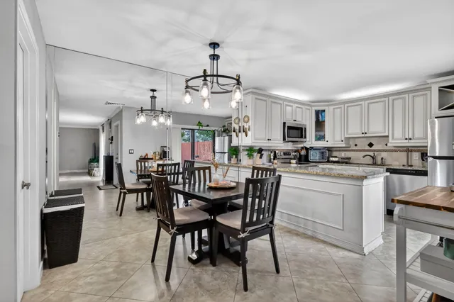 a view of a dining room kitchen and a window