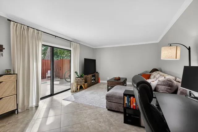 a livingroom with workspace and a couch