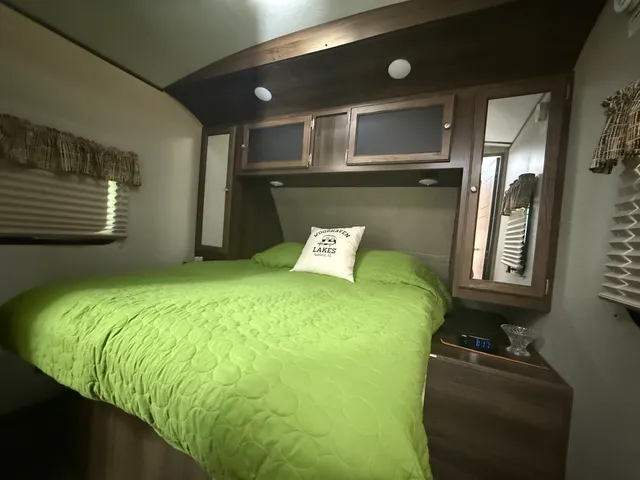 a view of backyard with deck and seating space