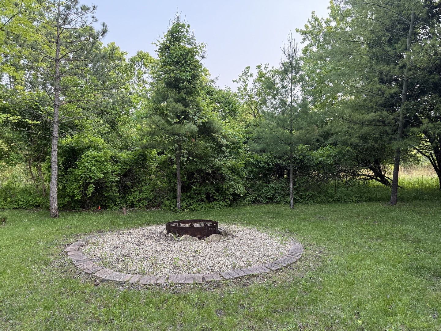 28-27 Woodhaven Lakes Sublette, IL 61367 - Photo 18 of 21 a view of a backyard