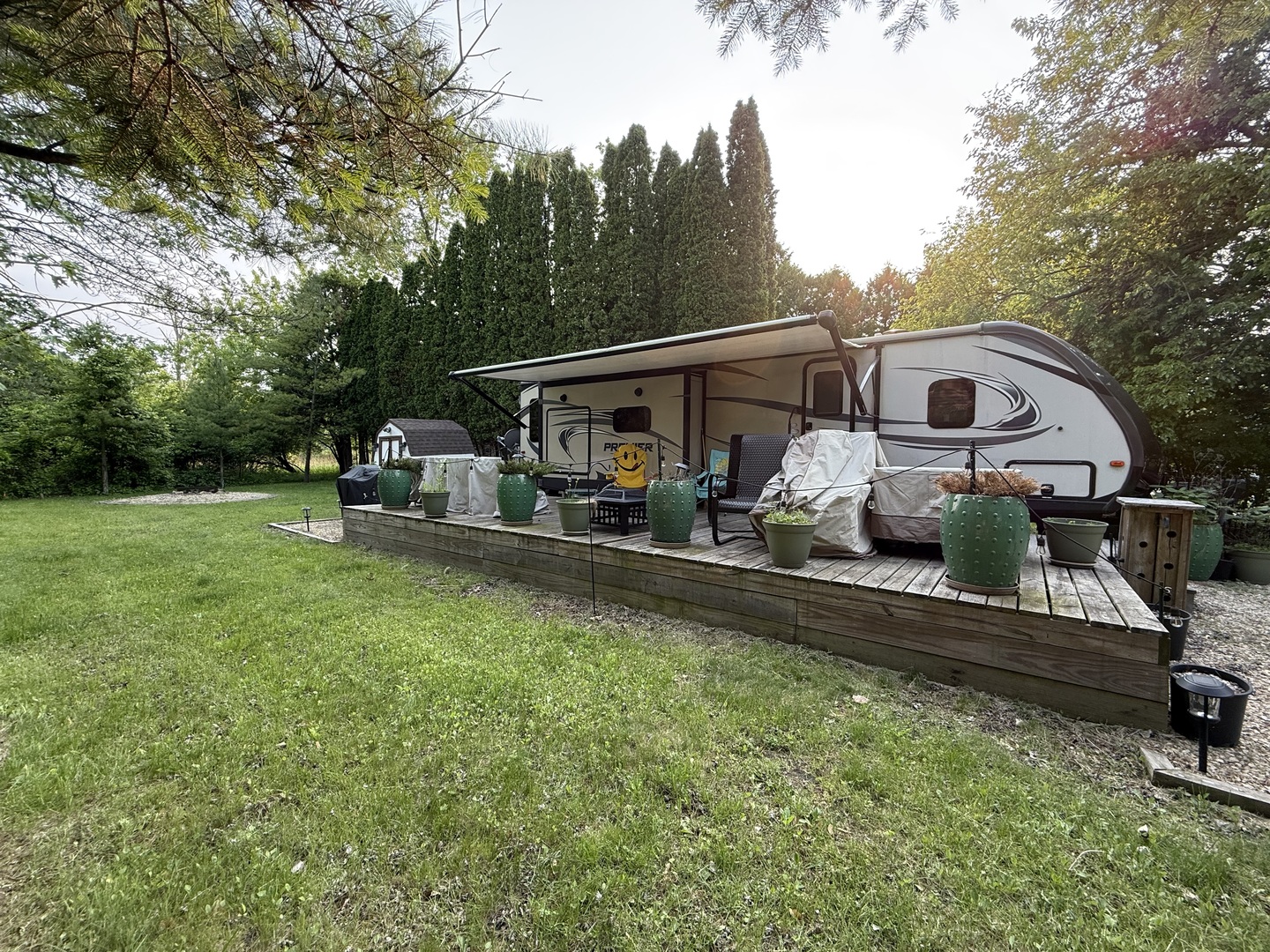 28-27 Woodhaven Lakes Sublette, IL 61367 - Photo 4 of 21 a view of two chairs in the backyard