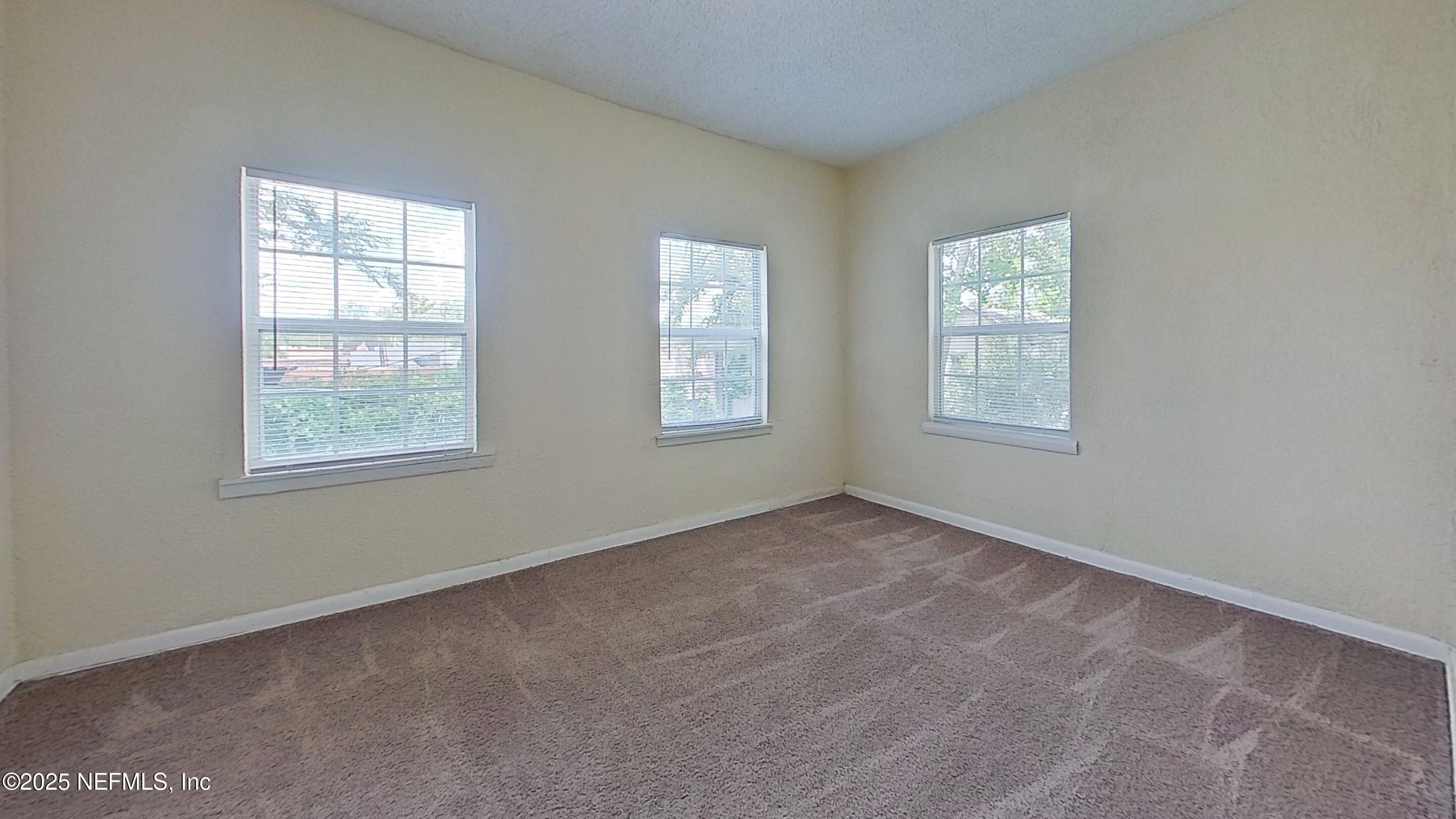 2673 Forbes Street, Unit C Jacksonville, FL 32204 - Photo 11 of 13 an empty room with windows