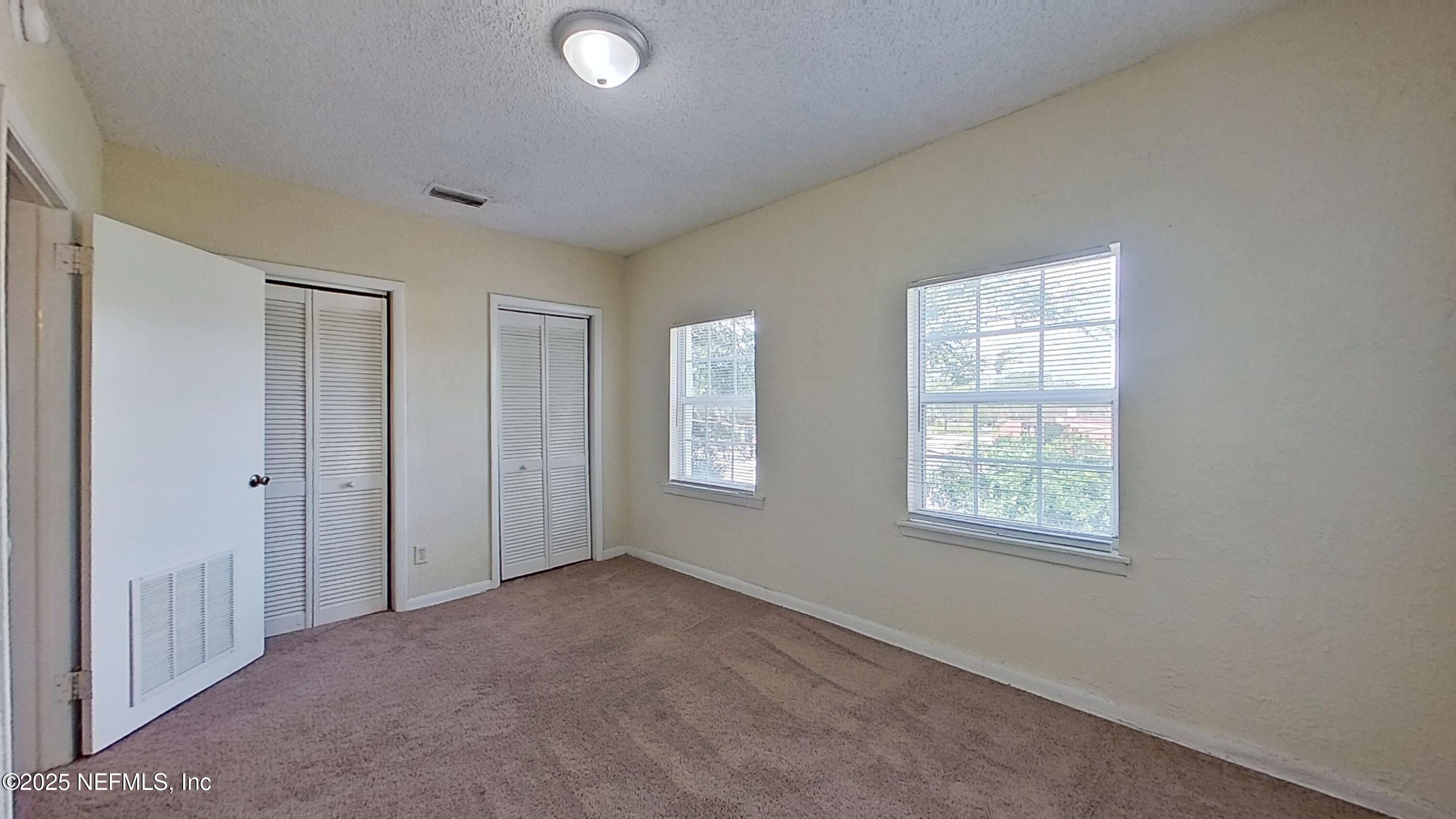 2673 Forbes Street, Unit C Jacksonville, FL 32204 - Photo 12 of 13 a view of an empty room with a window