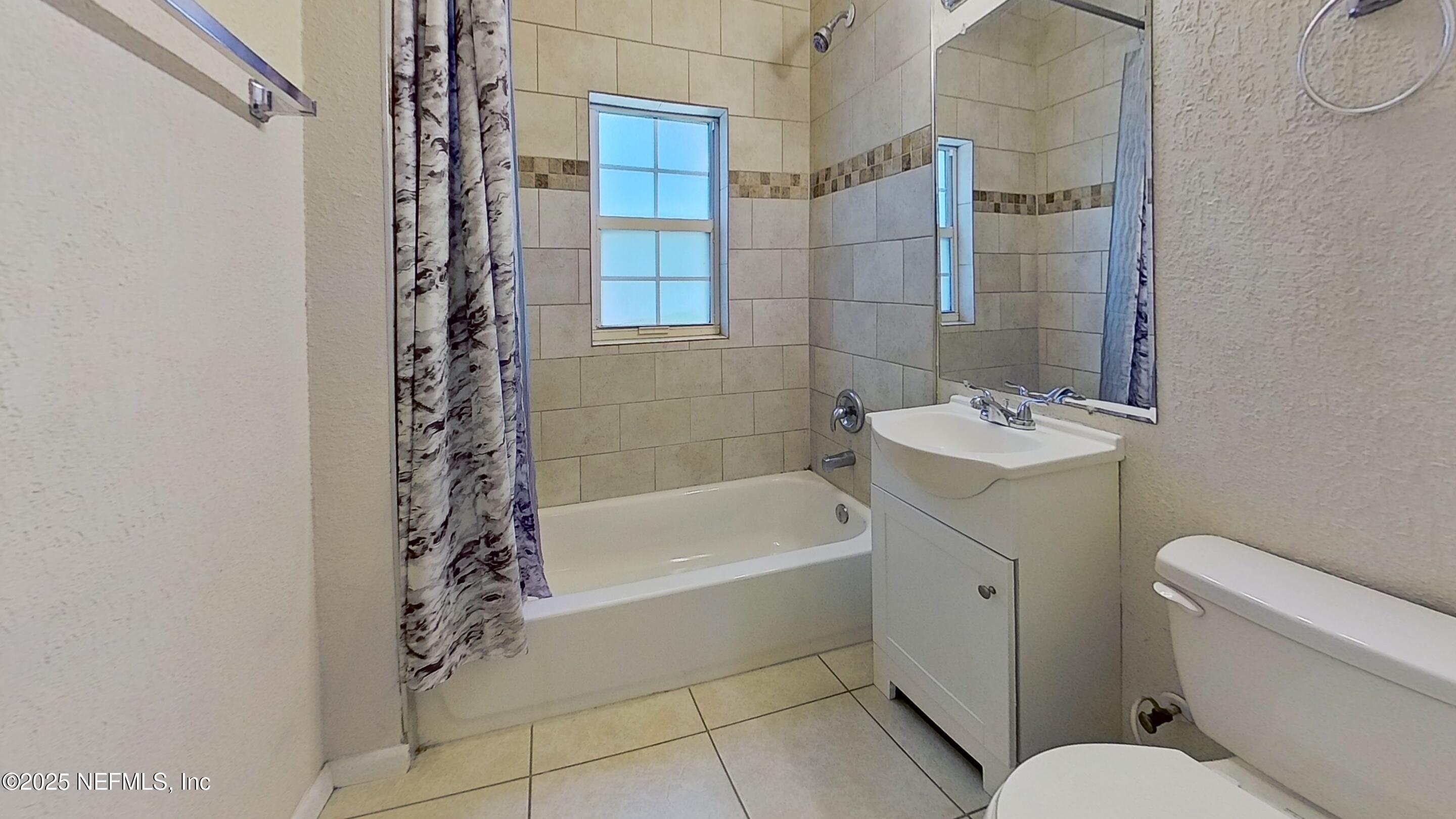 2673 Forbes Street, Unit C Jacksonville, FL 32204 - Photo 13 of 13 a bathroom with a sink toilet and shower