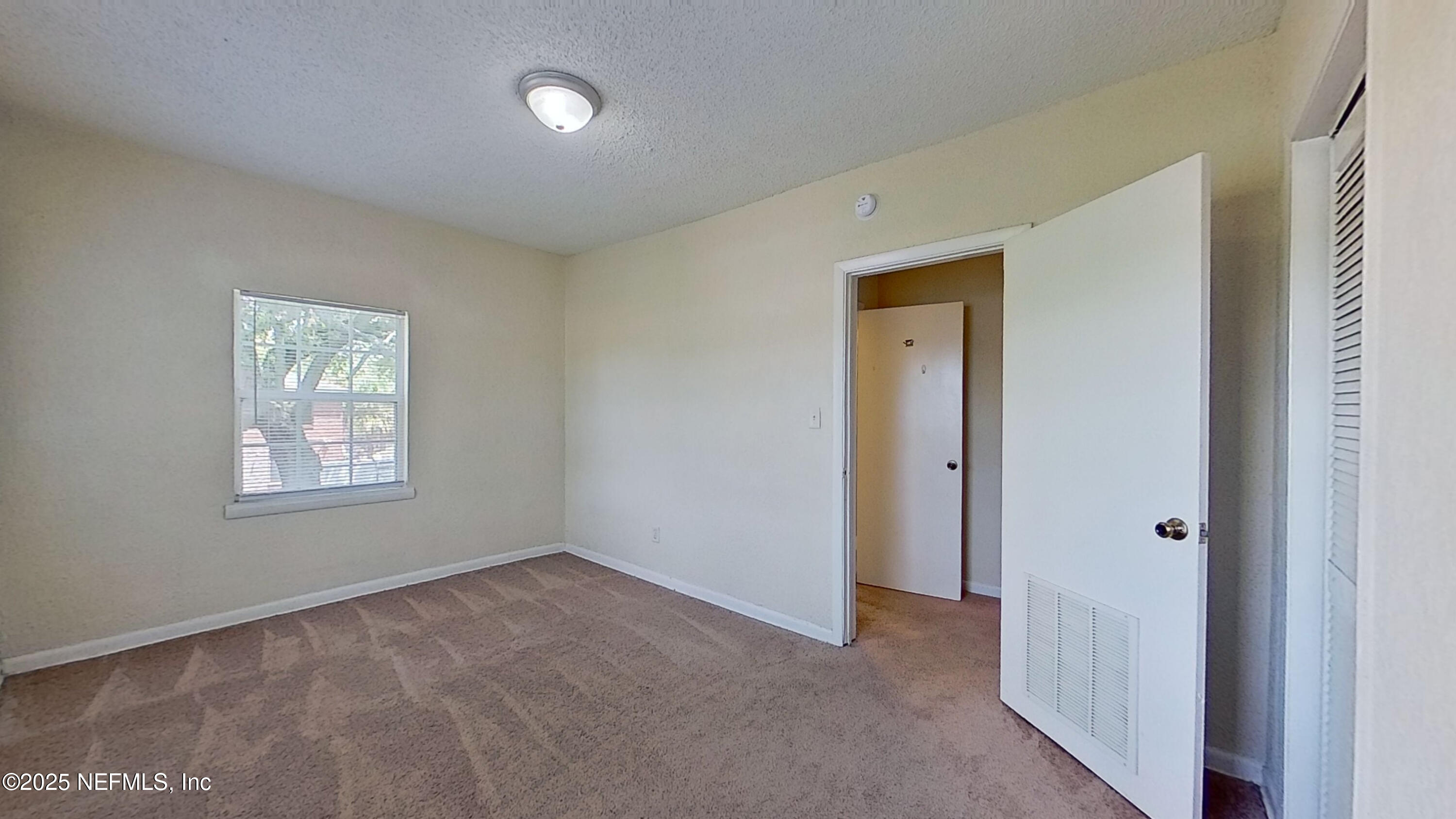 2673 Forbes Street, Unit C Jacksonville, FL 32204 - Photo 10 of 13 a view of an empty room with a window
