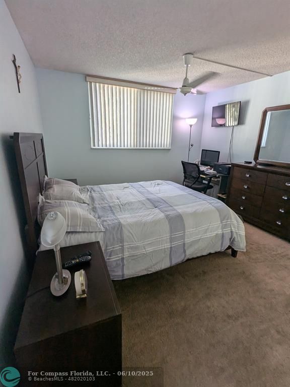 3130 Holiday Springs Boulevard, Unit 204 Margate, FL 33063 - Photo 12 of 32 a bedroom with a bed and window