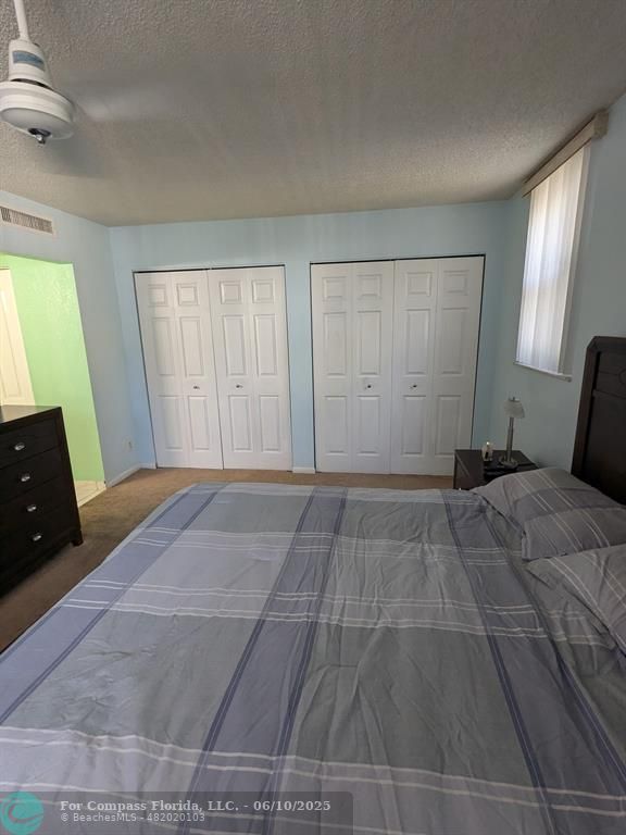 3130 Holiday Springs Boulevard, Unit 204 Margate, FL 33063 - Photo 13 of 32 a view of a livingroom with a dresser and window