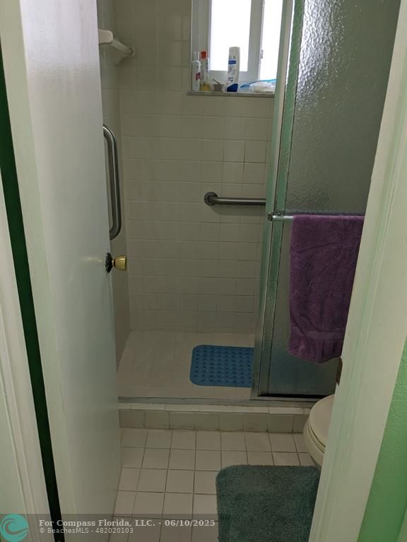 3130 Holiday Springs Boulevard, Unit 204 Margate, FL 33063 - Photo 16 of 32 a bathroom with a shower