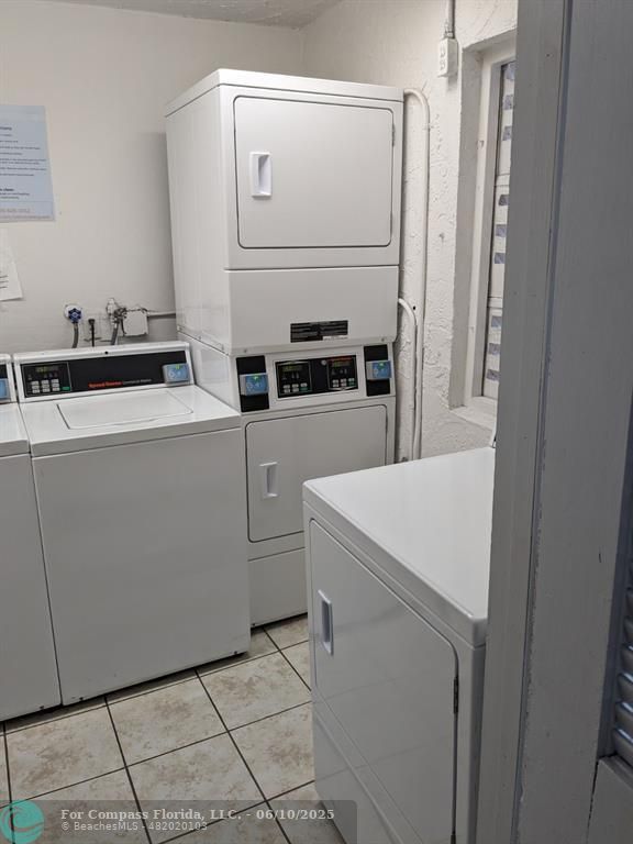3130 Holiday Springs Boulevard, Unit 204 Margate, FL 33063 - Photo 25 of 32 a utility room with dryer and washer