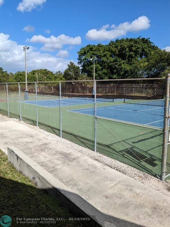 3130 Holiday Springs Boulevard, Unit 204 Margate, FL 33063 - Photo 32 of 32 a view of a tennis court