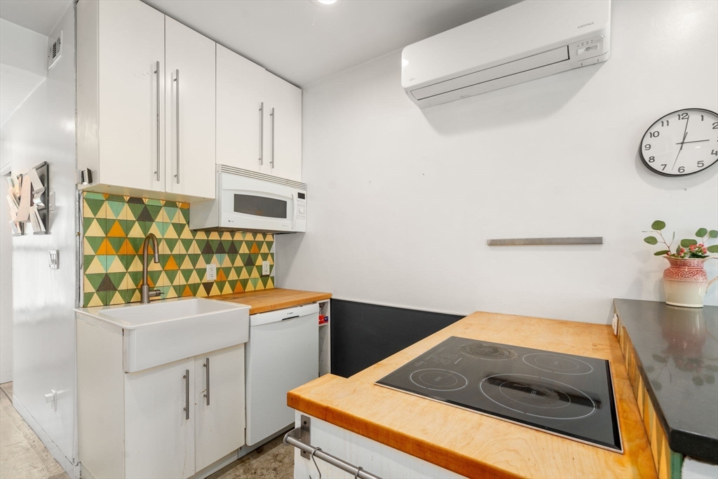 67 Dudley Street, Unit SF Boston, MA 02119 - Photo 3 of 28 a utility room with dryer and washer