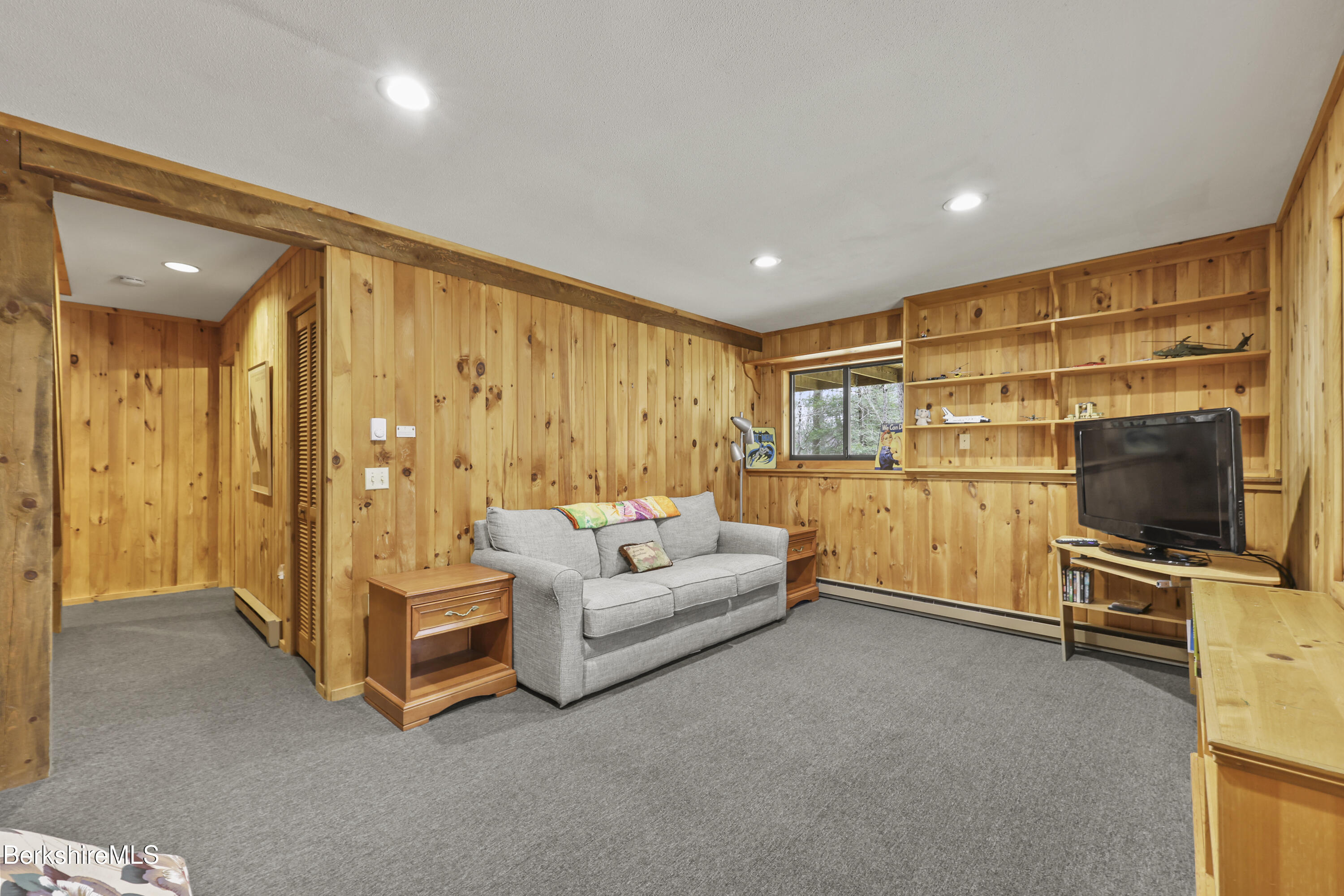 125 Town Hill Road Sandisfield, MA 01255 - Photo 29 of 42 a living room with furniture and a flat screen tv