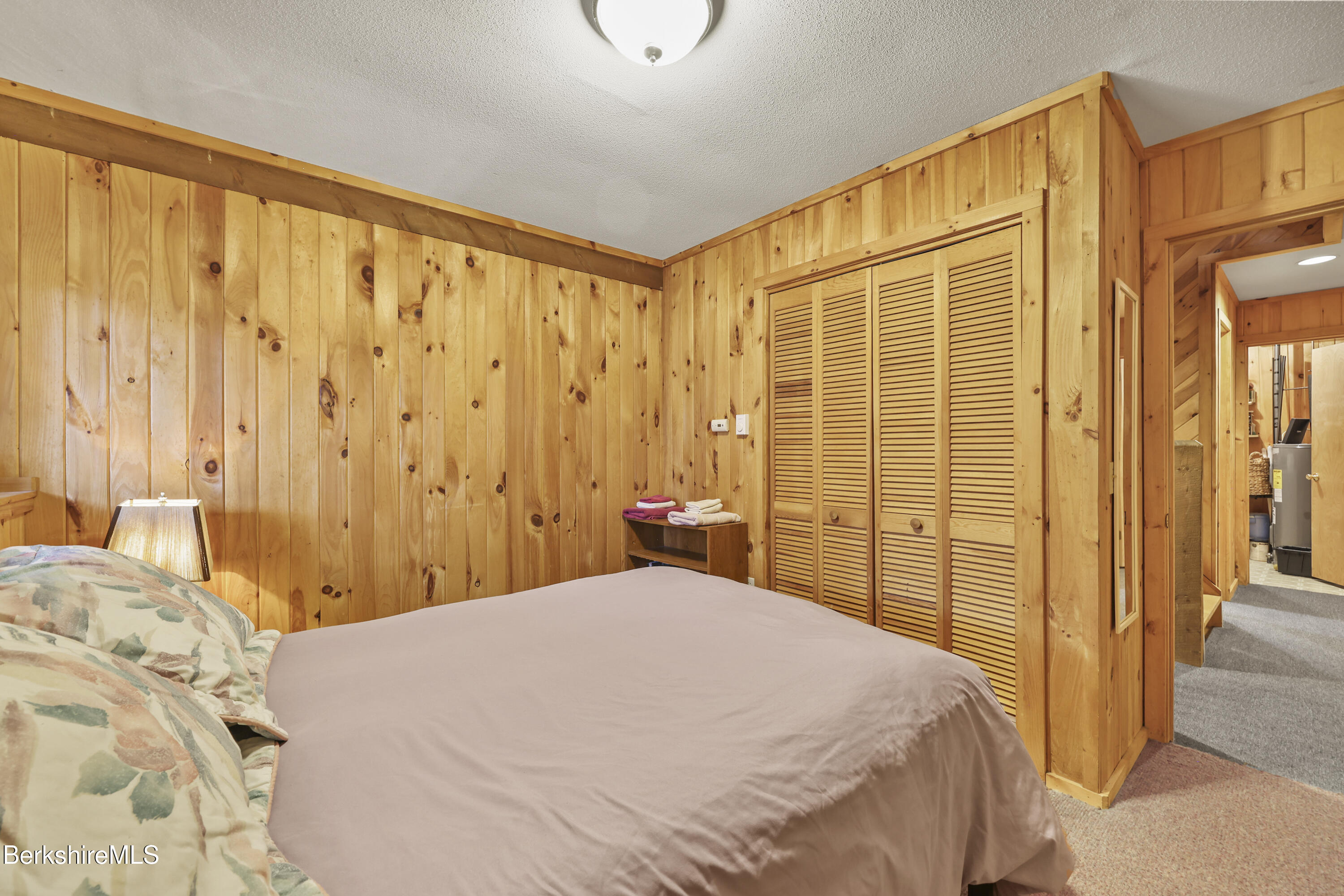 125 Town Hill Road Sandisfield, MA 01255 - Photo 32 of 42 a bedroom with a bed and a shower