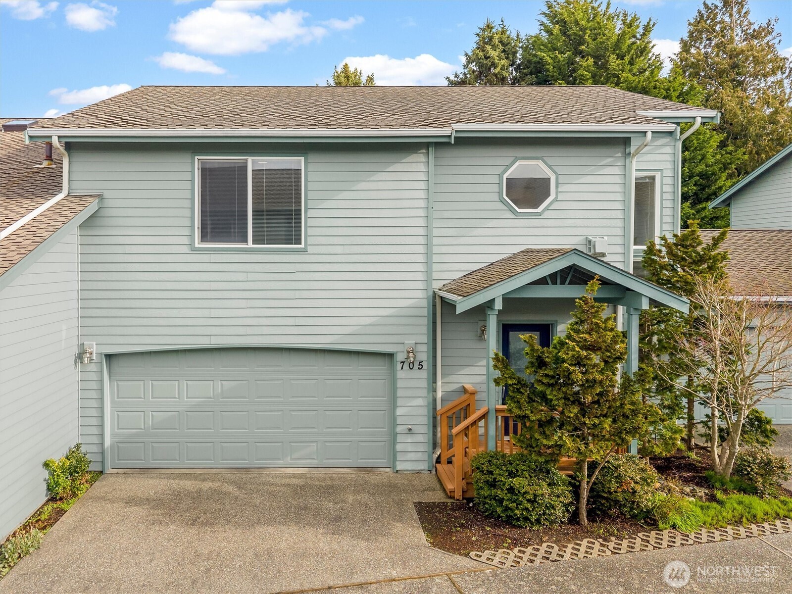 a front view of a house with garage