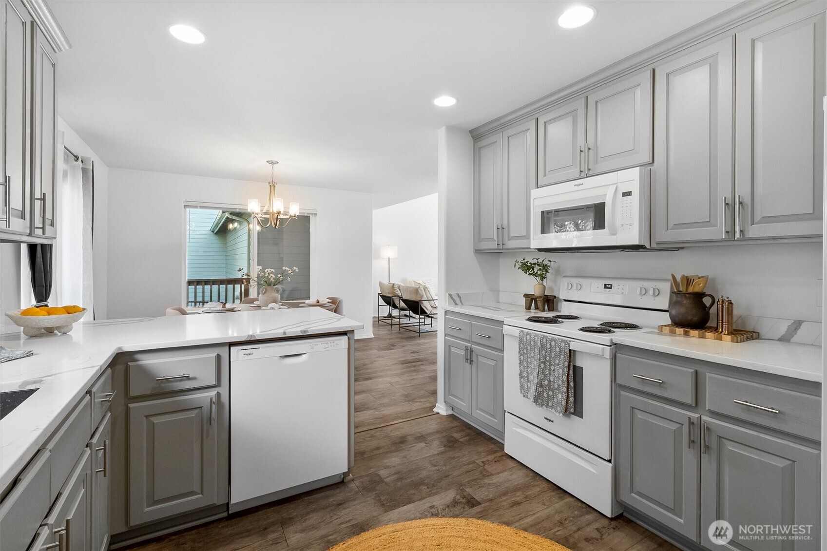 705 Finley Lane, Unit N2 La Conner, WA 98257 - Photo 13 of 38 a kitchen with white cabinets sink and stainless steel appliances