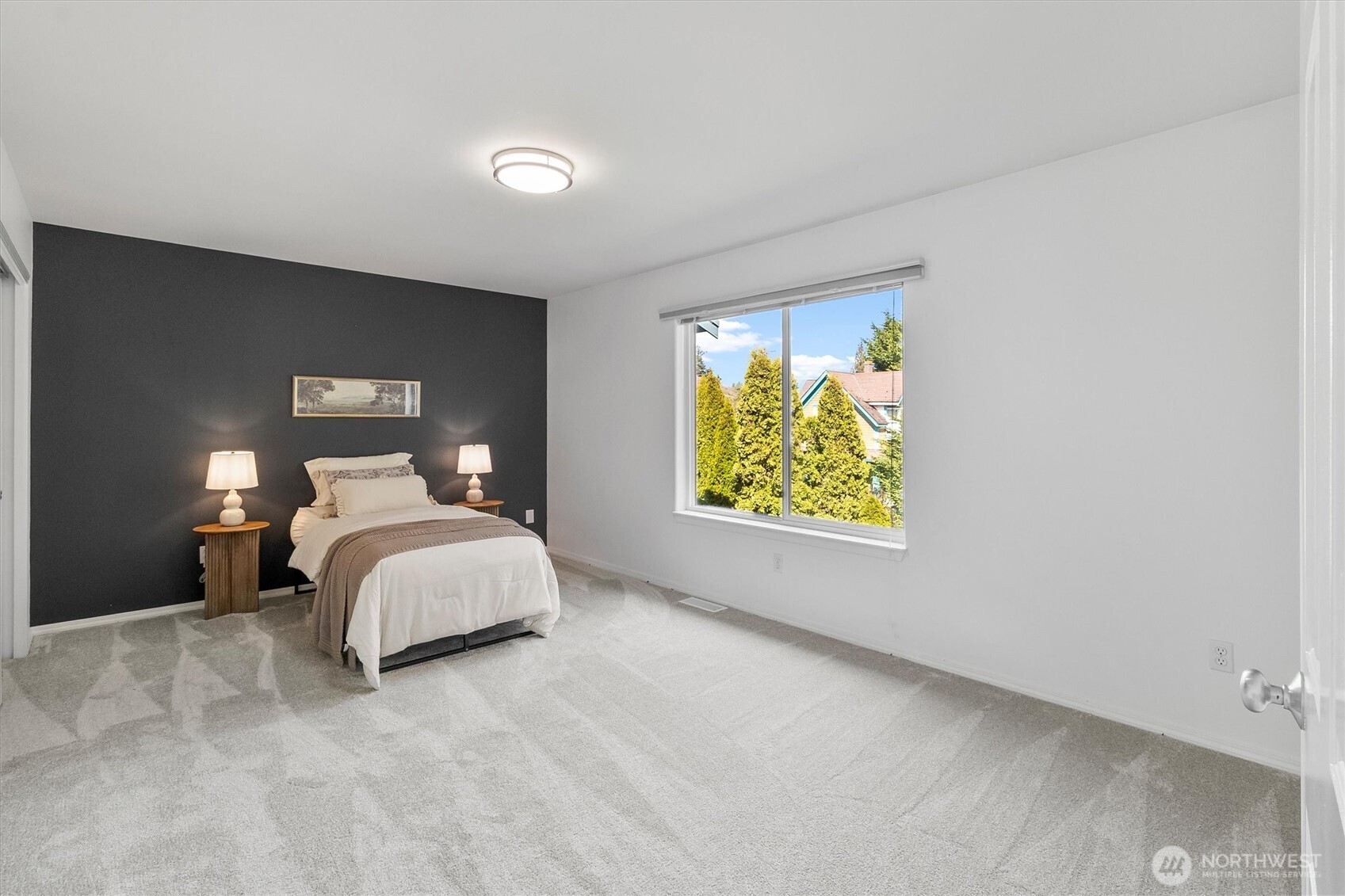 705 Finley Lane, Unit N2 La Conner, WA 98257 - Photo 24 of 38 a bedroom with a bed and a window