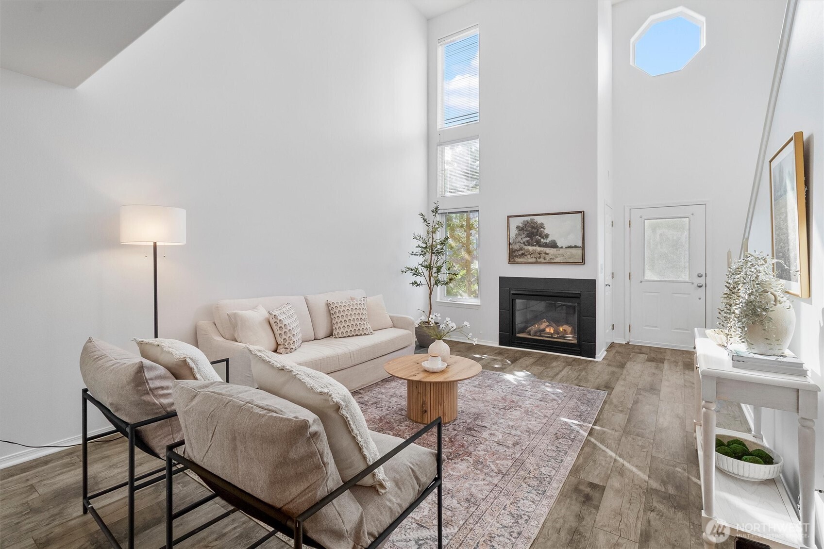 705 Finley Lane, Unit N2 La Conner, WA 98257 - Photo 7 of 38 a living room with furniture and a fireplace