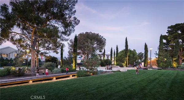 a view of a tennis court with outdoor seating