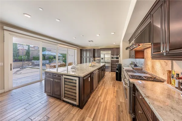 a kitchen with stainless steel appliances granite countertop a stove and a sink