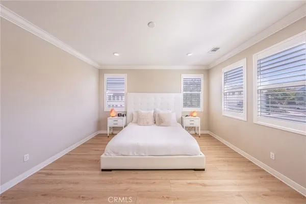 a large white bed in a white room
