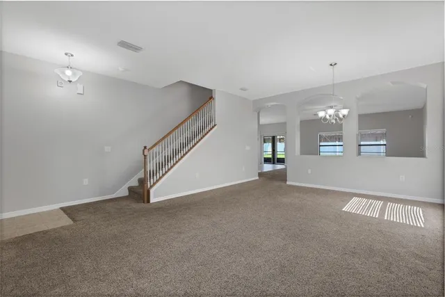 a view of an empty room with a fireplace