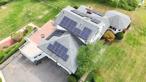 an aerial view of a house having yard