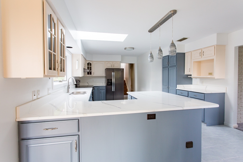 13 Juniper Hill Road Ware, MA 01082 - Photo 7 of 42 a kitchen with kitchen island a sink appliances and cabinets