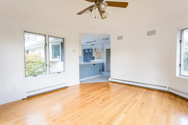 a view of an empty room with a window