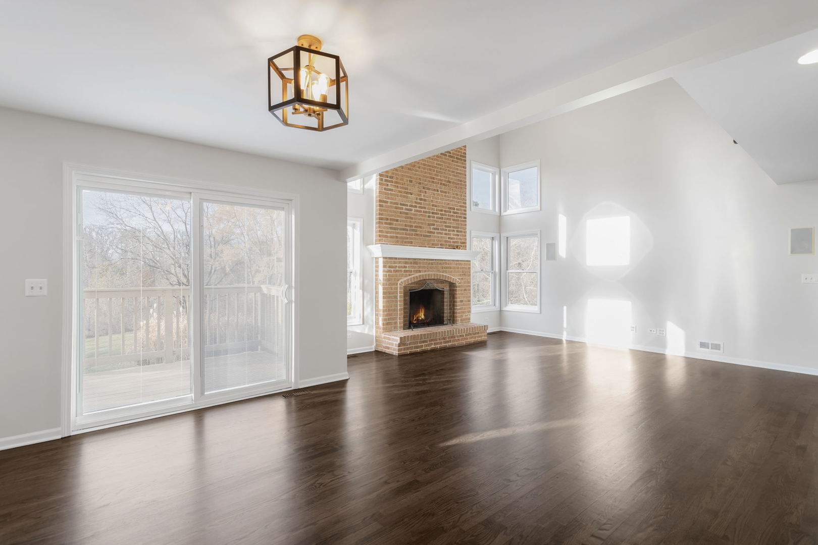 537 Arbor Lane Oswego, IL 60543 - Photo 11 of 33 a view of an empty room with wooden floor and a window