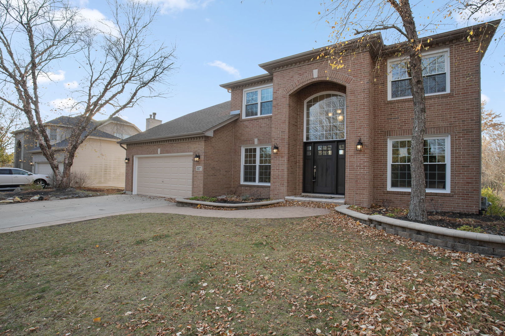 537 Arbor Lane Oswego, IL 60543 - Photo 2 of 33 a front view of a house with garden