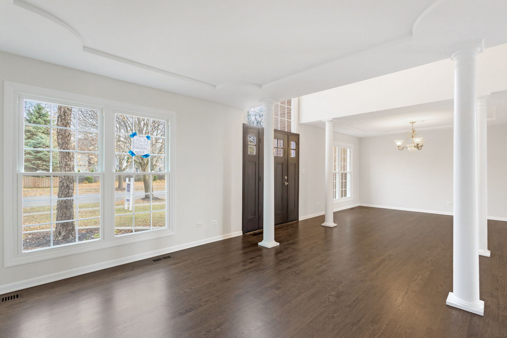 537 Arbor Lane Oswego, IL 60543 - Photo 9 of 33 a view of an empty room with wooden floor and a window