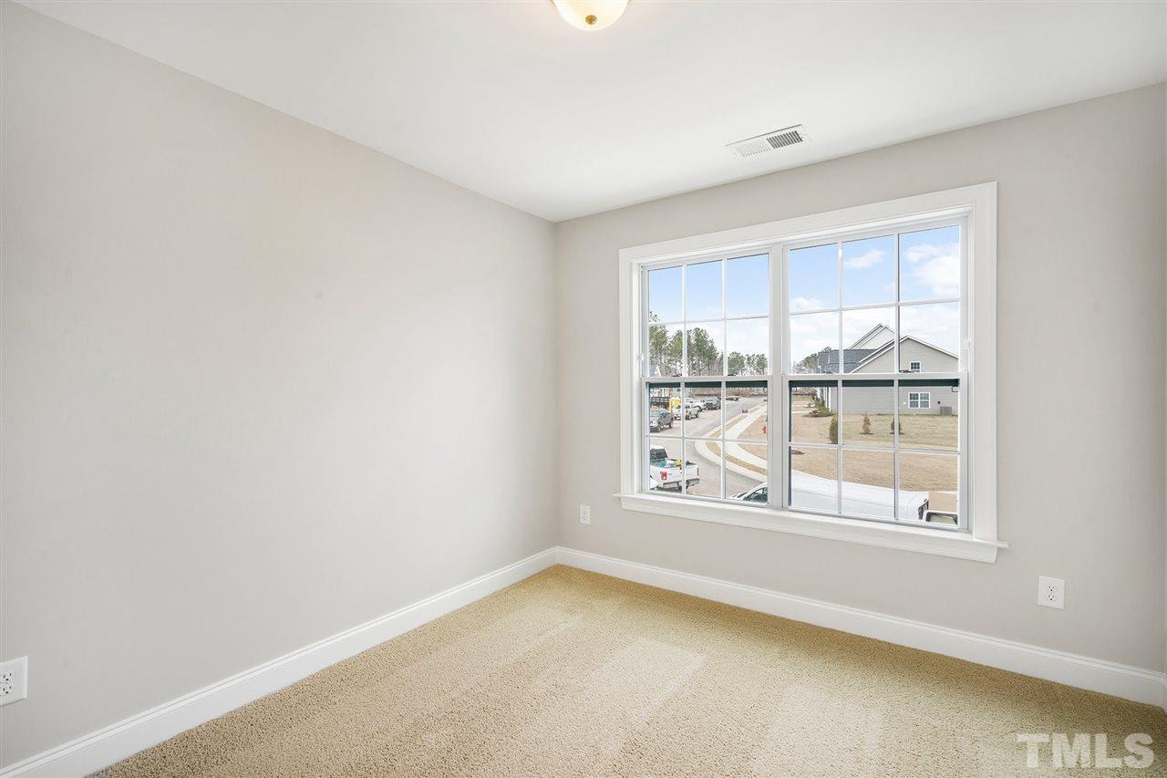 112 Edmer Lane Garner, NC 27529 - Photo 12 of 24 an empty room with windows