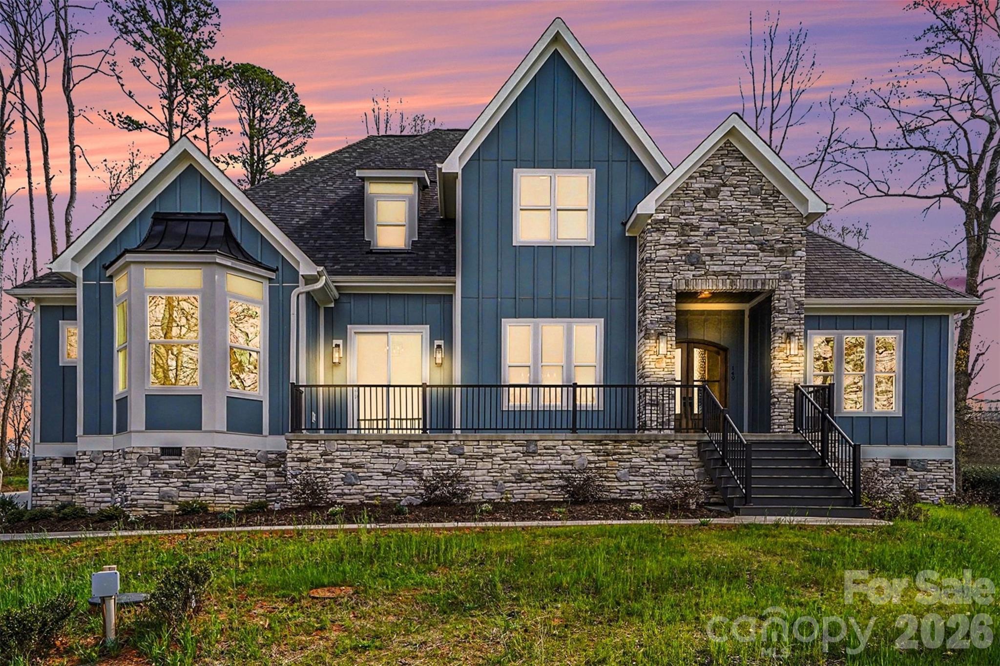 149 Shady Cove Road Troutman, NC 28166 - Photo 1 of 48 a front view of a house with a yard