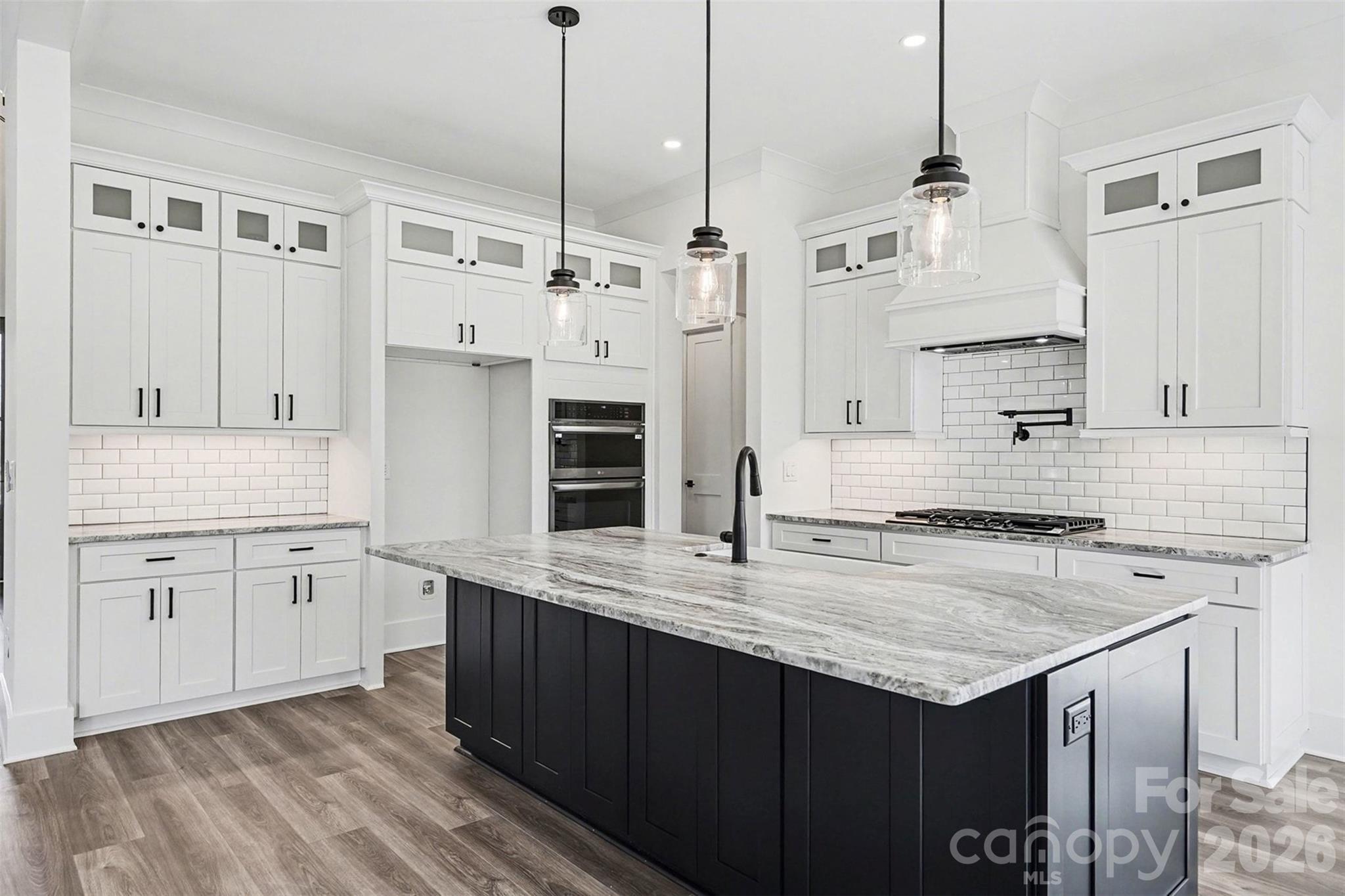 149 Shady Cove Road Troutman, NC 28166 - Photo 12 of 48 a kitchen with stainless steel appliances granite countertop a sink stove and refrigerator