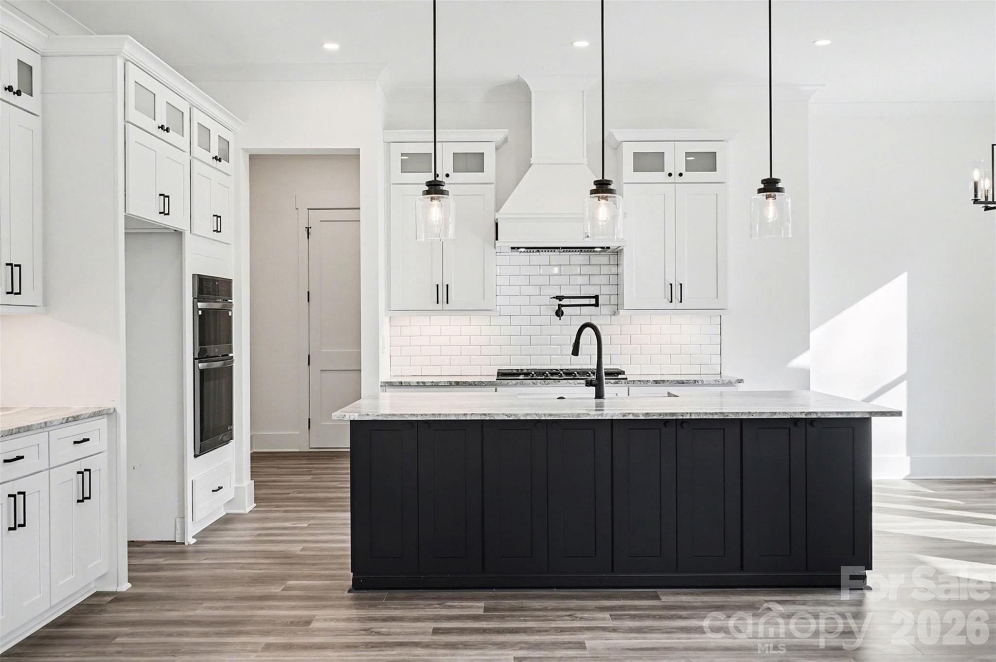 149 Shady Cove Road Troutman, NC 28166 - Photo 13 of 48 a kitchen with stainless steel appliances granite countertop a sink and a refrigerator