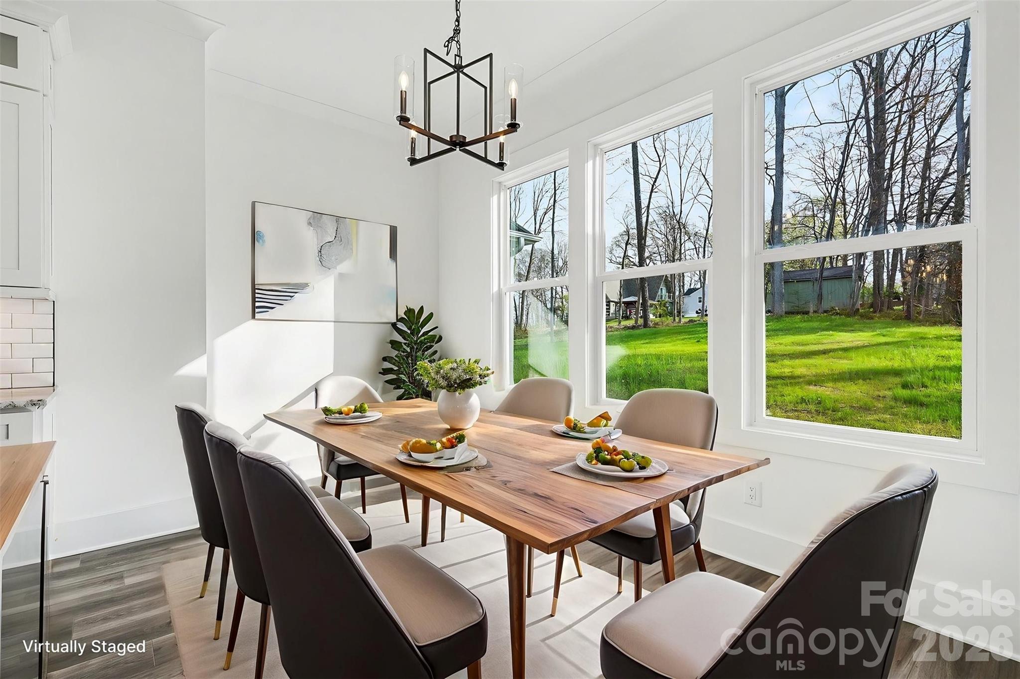 149 Shady Cove Road Troutman, NC 28166 - Photo 16 of 48 a view of a dining room with furniture window and outside view