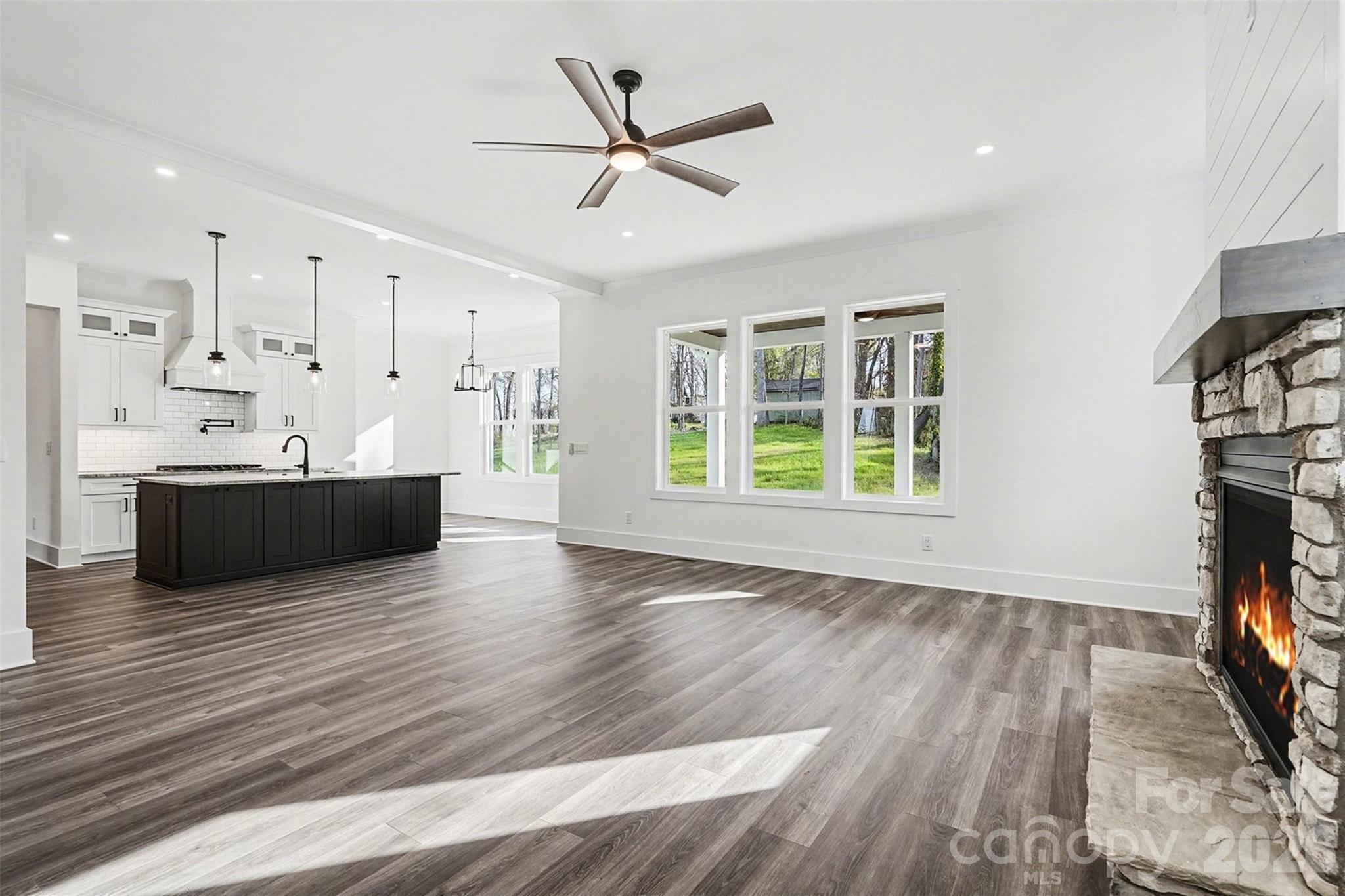 149 Shady Cove Road Troutman, NC 28166 - Photo 19 of 48 a view of kitchen and kitchen with wooden floor