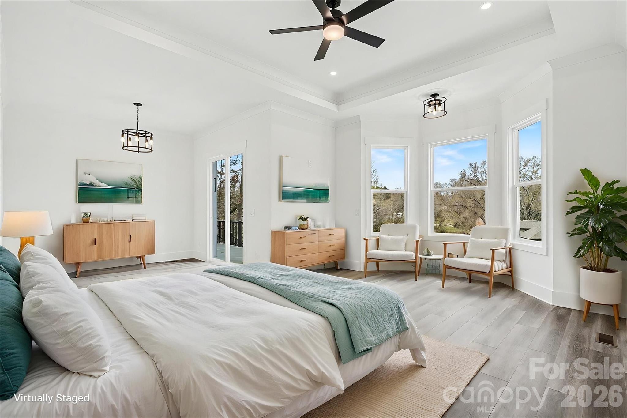 149 Shady Cove Road Troutman, NC 28166 - Photo 20 of 48 a bedroom with a large bed and a window