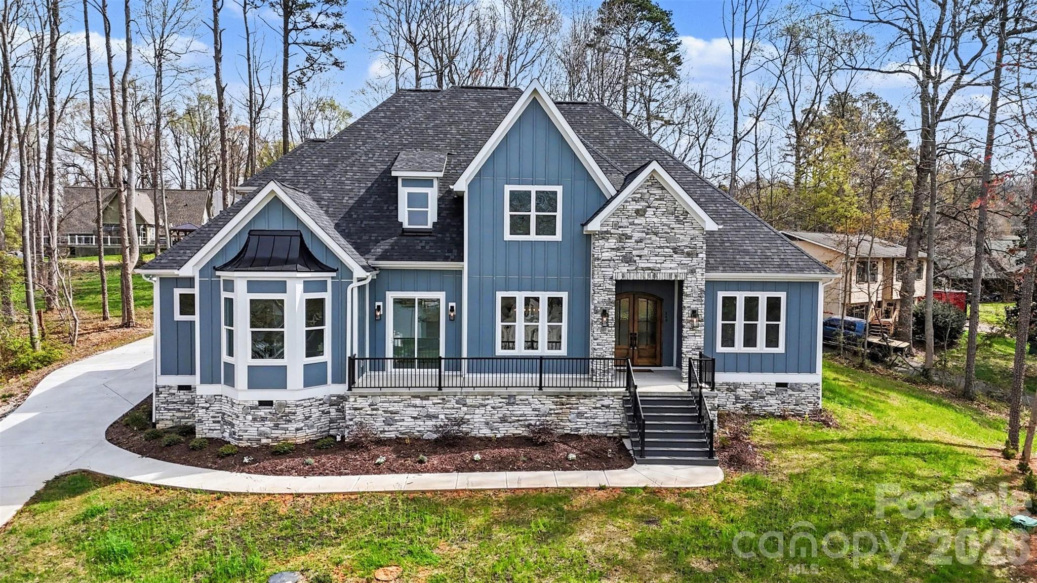 149 Shady Cove Road Troutman, NC 28166 - Photo 2 of 48 a front view of a house with a yard