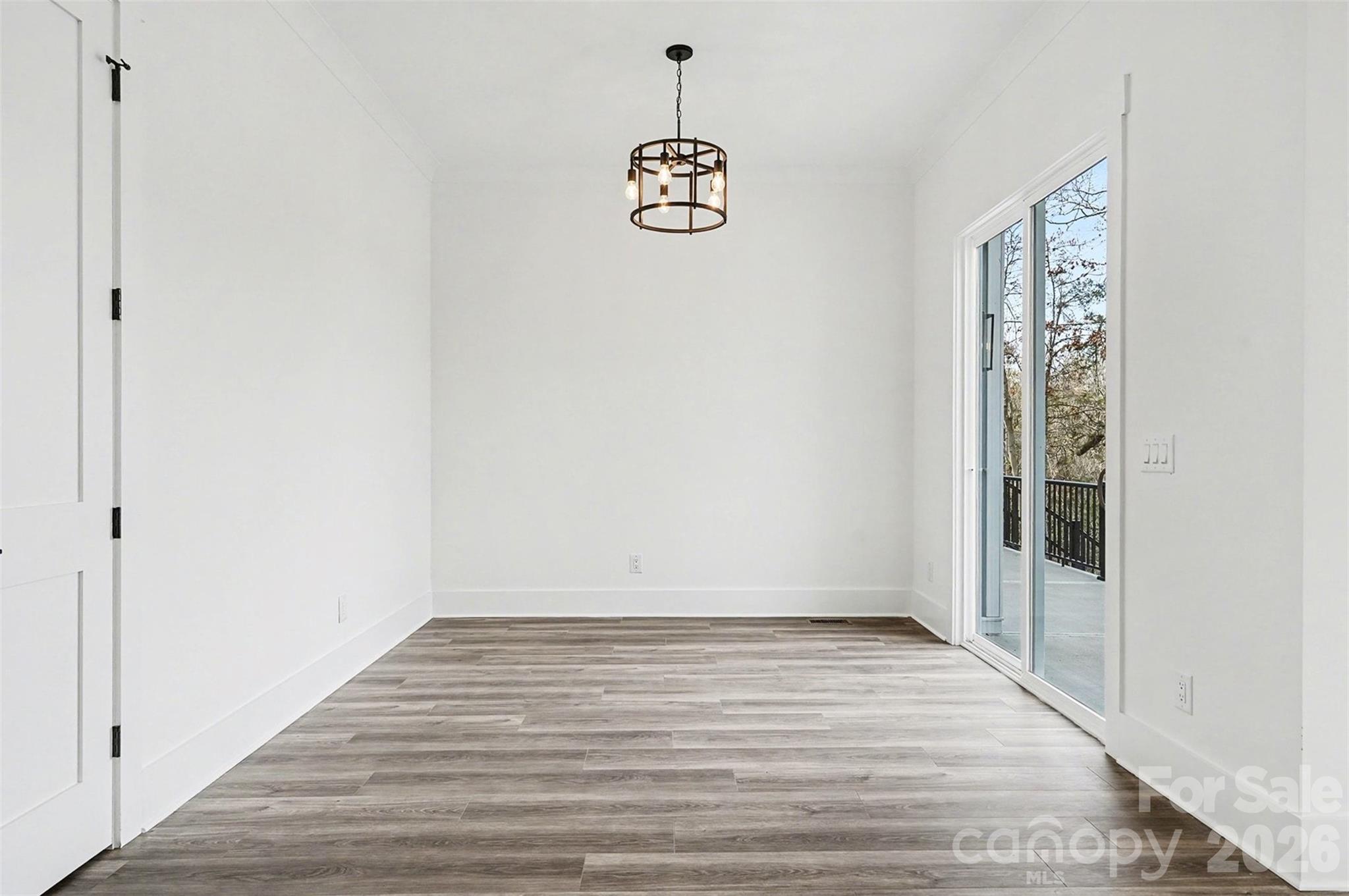 149 Shady Cove Road Troutman, NC 28166 - Photo 22 of 48 a view of an entryway with wooden floor