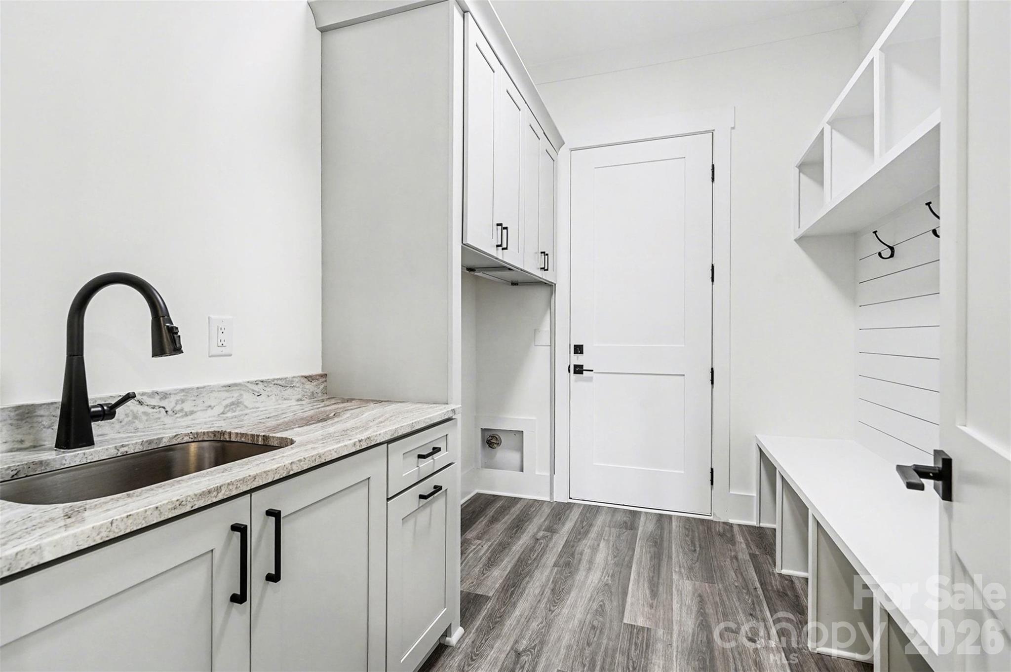 149 Shady Cove Road Troutman, NC 28166 - Photo 26 of 48 a kitchen with a sink and a refrigerator