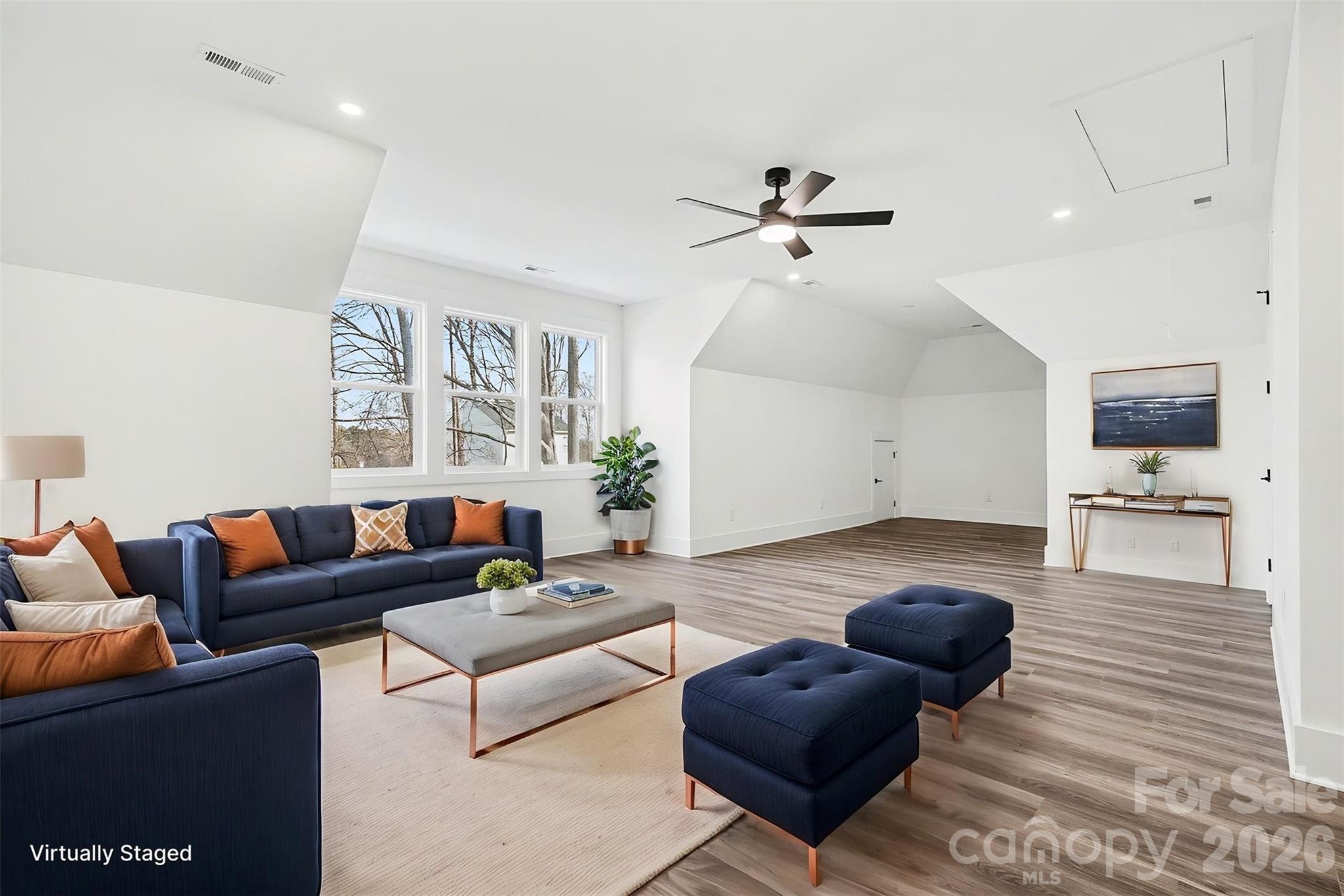 149 Shady Cove Road Troutman, NC 28166 - Photo 30 of 48 a living room with furniture and a view of kitchen