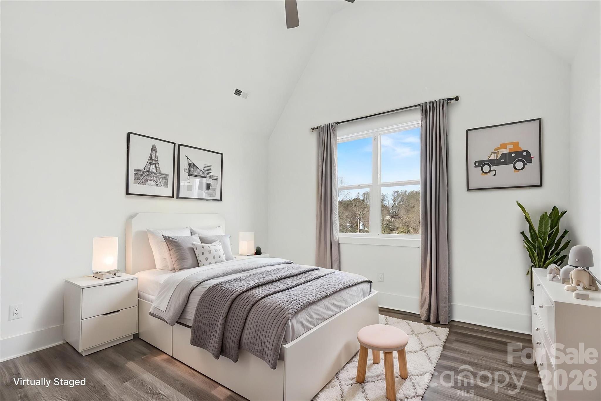 149 Shady Cove Road Troutman, NC 28166 - Photo 33 of 48 a bedroom with a large bed and a window